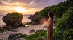 沖縄の聖地で夕日を浴びながら瞑想する女性。手には光る石を持ち、スピリチュアルな旅を通じて前世の記憶と繋がり、魂のルーツを探求する神秘的な様子を捉えた一枚です。